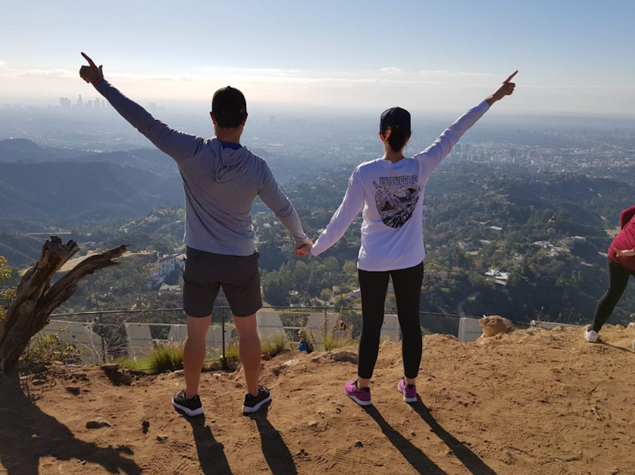 Two hikers at the top of the Hollywood Sign after their Hollywood Sign tour