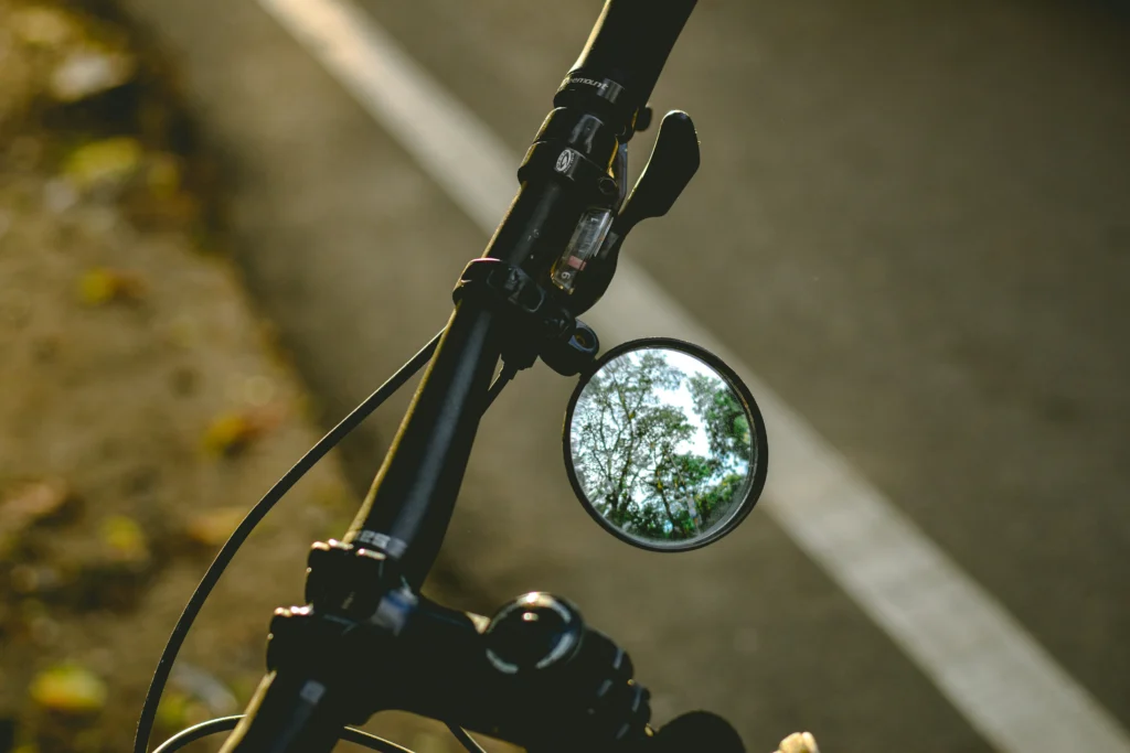 Black motorcycle side mirror close up